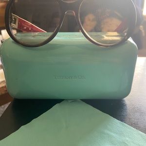 Tiffany & Co. sunglasses. Used. Comes with 3 pair interchangeable charms w/tool